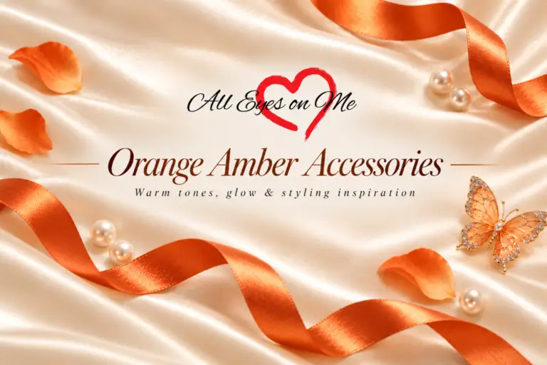 Orange Amber Accessories banner with orange satin ribbon, jeweled butterfly, petals and pearls on champagne satin