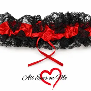 Red satin garter with black lace, red ribbon and rose detail, front view