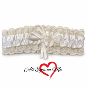 White satin garter with lace, fabric flower and pearl-like accents, front view