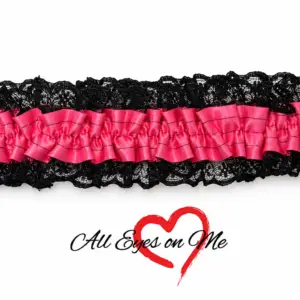 Hot pink gathered satin garter with black lace trim, front view