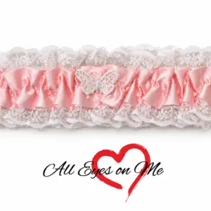 Baby pink garter with white lace trim and white butterfly detail, front view