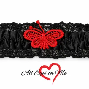 Black gathered garter with black lace trim and red butterfly detail, front view