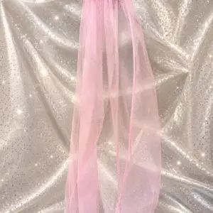 Baby pink tulle veil with light pink feather trim