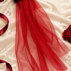 Dark red tulle veil with black feather trim