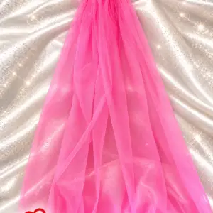 Hot pink tulle veil with baby pink feather trim