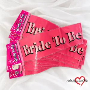 Close-up of Bride To Be lettering on pink sash