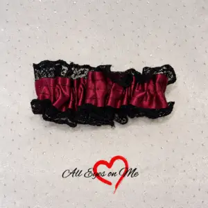 Burgundy and black wrist garter with gathered burgundy band and black lace trim
