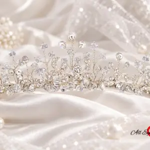 Styled silver-tone floral vine crystal-style bridal tiara displayed for a wedding accessory presentation