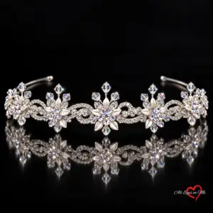 Silver-tone floral scroll crystal-style bridal tiara E5-5940 on a black background