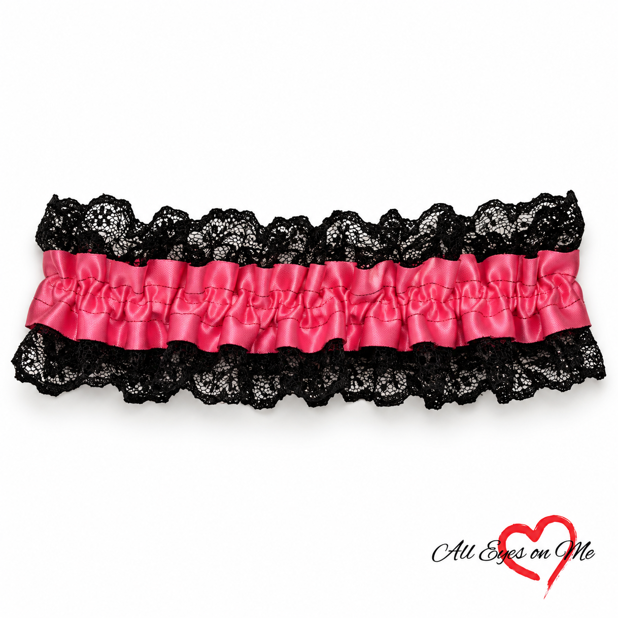 One hot pink wrist garter with a gathered band and black lace trim