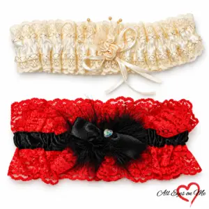 Off-white lace garter with a rose detail above a red and black lace garter