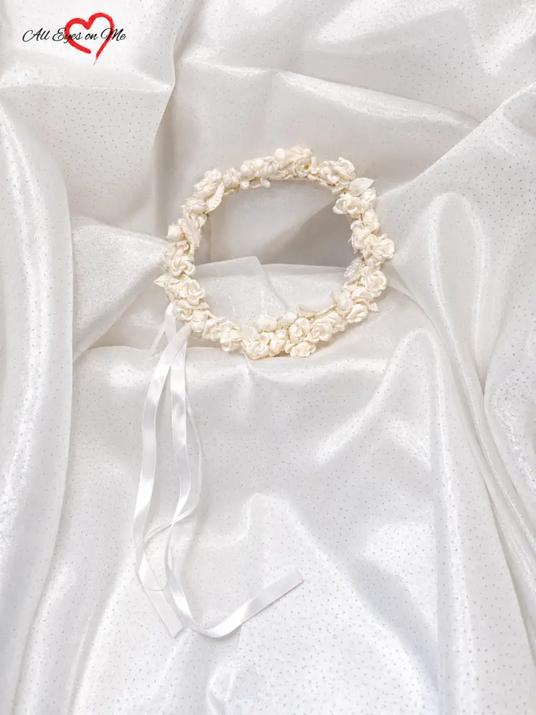 White and ivory handmade fabric rose flower crown with decorative leaves and long white ribbon ties